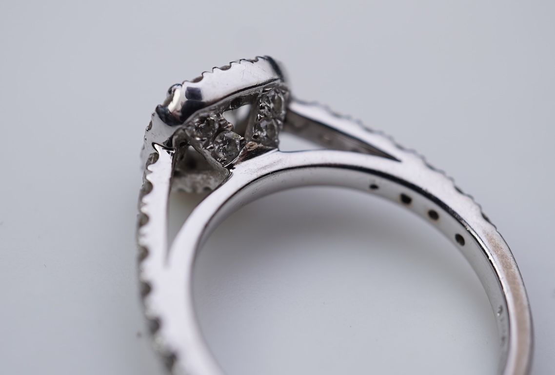 A diamond engagement ring and half eternity ring